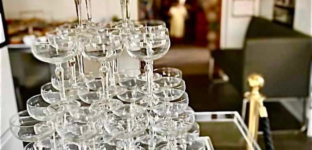 Luxurious and Sophisticated Champagne Tower and Toasting Glass Services for Weddings and Corporate Events